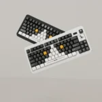 Distinctive Cow Cat PBT keycaps set in high-contrast black and white, showcasing playful cow cat motifs on a custom keyboard, offering an artistic touch.