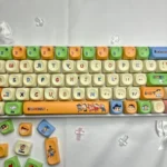 Playful Crayon Shin-chan MOA keycap set with vibrant characters and scenes on durable dye-sub PBT caps, viewed from multiple angles.