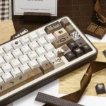 Artistic Crispy Dark Chocolate Keycaps set, showcasing its unique PBT aesthetic from multiple angles. Features rich, textured chocolate hues.