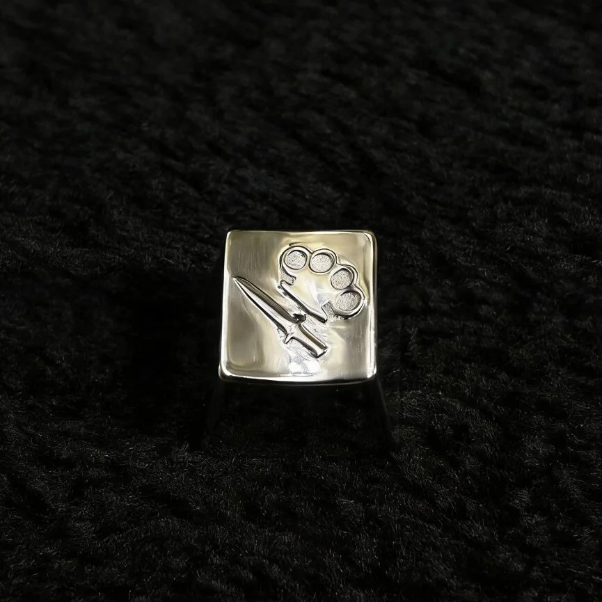 Detailed side view of a premium CSGO keycap, showcasing its authentic metallic replica design and intricate craftsmanship. This artisan art piece.