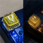 A detailed view of the premium CSGO Team Vitality backlit ESC keycap, showcasing its luminous hollow bee logo and sleek gaming design from a unique angle.