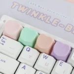 A collection of cute heart keycaps for ESC, showcasing their adorable pastel design from various angles, perfect for a playful, personalized keyboard.