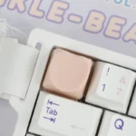 Close-up of an adorable pastel hues heart keycap from multiple angles, highlighting its whimsical design and playful charm as a personalized ESC keyboard.