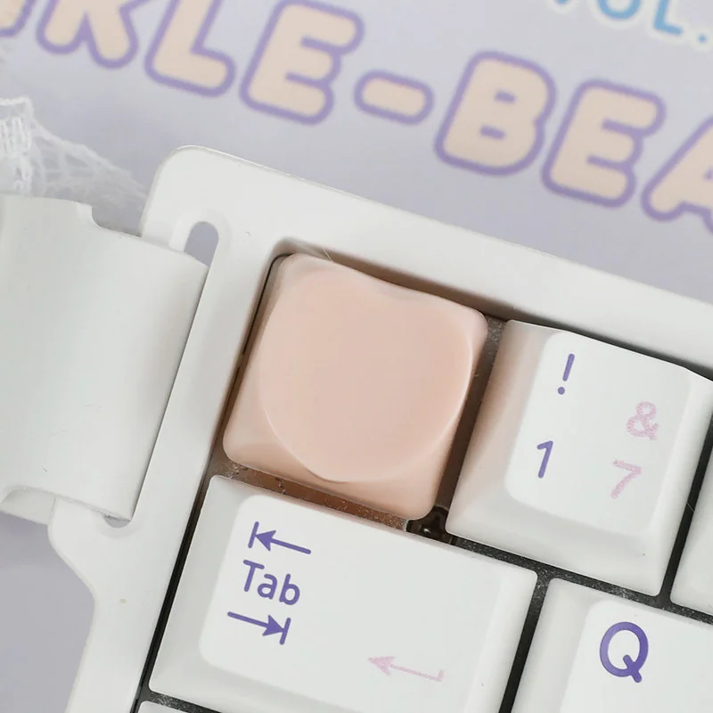 Close-up of an adorable pastel hues heart keycap from multiple angles, highlighting its whimsical design and playful charm as a personalized ESC keyboard.