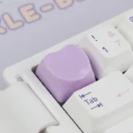 Playful gallery of Cute Heart Keycap for ESC, showing its charming pastel heart from various angles, a personal keyboard accent.
