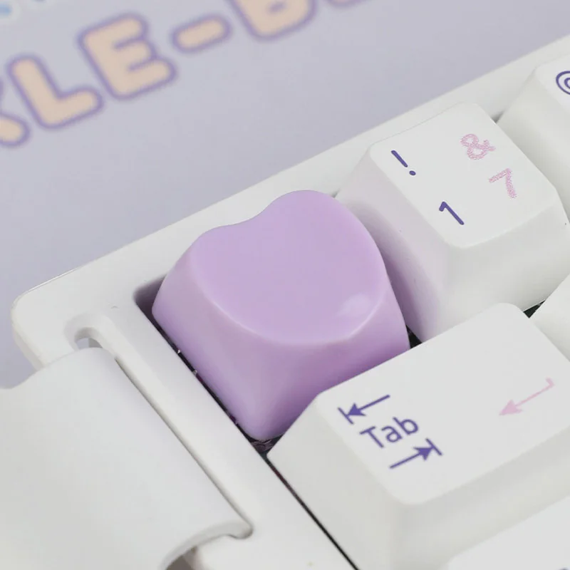Playful gallery of Cute Heart Keycap for ESC, showing its charming pastel heart from various angles, a personal keyboard accent.