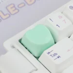 Cute Heart Keycap in a soft pastel shade, showcasing its adorable design and playful charm from a unique angle, perfect for a personalized keyboard.