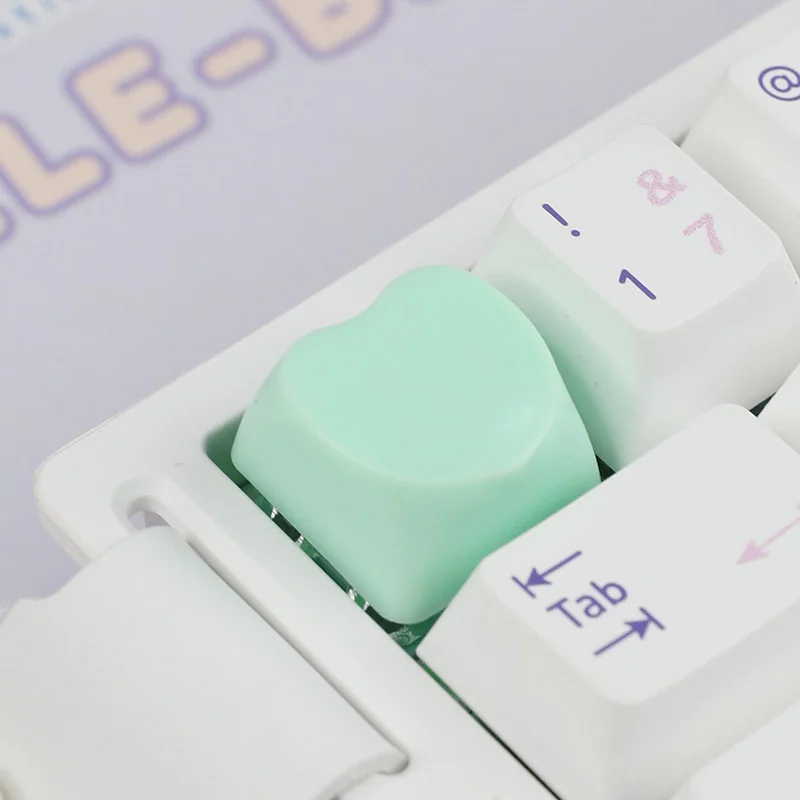 Cute Heart Keycap in a soft pastel shade, showcasing its adorable design and playful charm from a unique angle, perfect for a personalized keyboard.