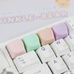 Close-up of a cute pastel hues heart keycap for the ESC key, showcasing its adorable design, adding a playful and personalized charm to your keyboard.