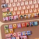 Multiple angles of an exquisite, handcrafted Demon Slayer artisan keycap set, showcasing intricate miniature diorama scenes and beloved anime characters design.