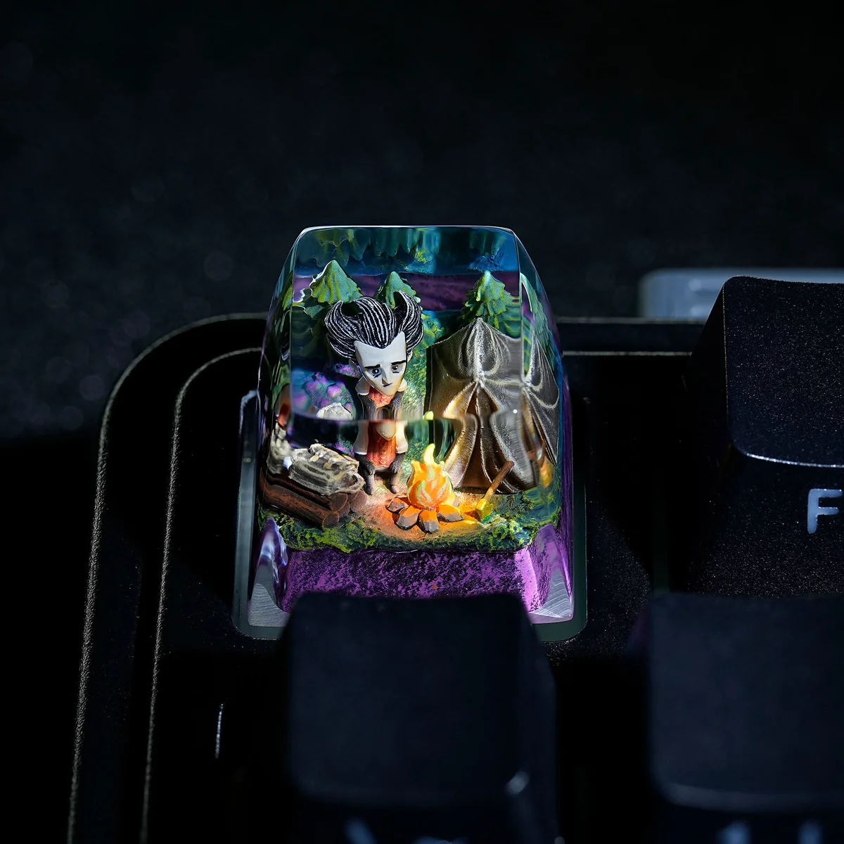 Detailed close-up of a hand-painted Don't Starve Wilson artisan keycap, highlighting its distinctive gothic art style and meticulous resin craftsmanship.