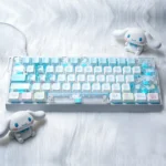 A playful side view of the exclusive Dreamy Cinnamoroll PBT+PC side-printed keycaps set, highlighting the adorable pastel character art.