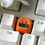 A vibrant gallery of playful handcrafted resin emoji keycaps from multiple angles, showcasing their glossy finish and personalized.