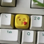 Vibrant handcrafted resin emoji keycap depicting a playful heart-eyes face, adding a touch of personalized love to your custom ESC key.