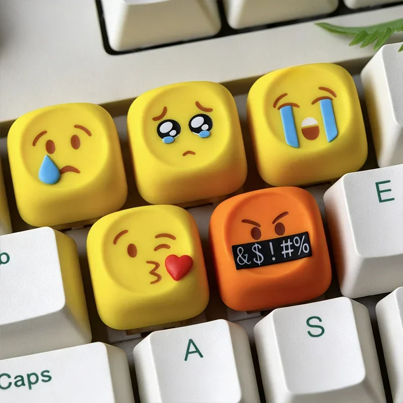 Vibrant, playful handcrafted resin emoji keycaps displayed, showcasing their glossy finish and expressive faces, perfect for personalized keyboard.