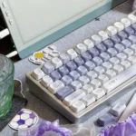 Angled view of Ethereal Butterfly PBT Keycaps set. Durable PBT and crisp dye-sub butterfly motifs on serene twilight gradients evoke mystical elegance.