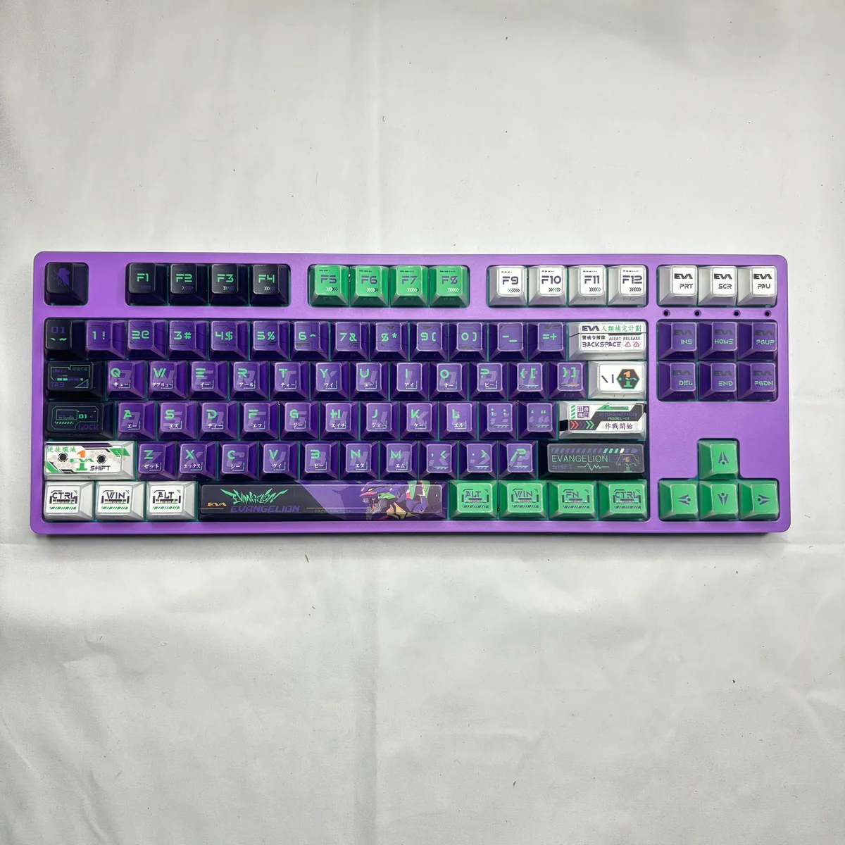 Multiple artistic angles of the Evangelion Unit-01 PBT keycaps set, revealing the iconic angular design and vibrant translucent side-printed legends.