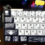 Close-up of the unique Fallen Angel keycaps set, showcasing multiple ethereal, gothic-inspired designs and mysterious angelic motifs from various angle.