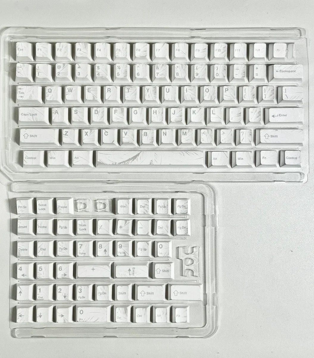 Gallery of feather pattern keycaps set, showcasing shimmering ethereal feather motifs and comfortable Cherry profile from various angles.