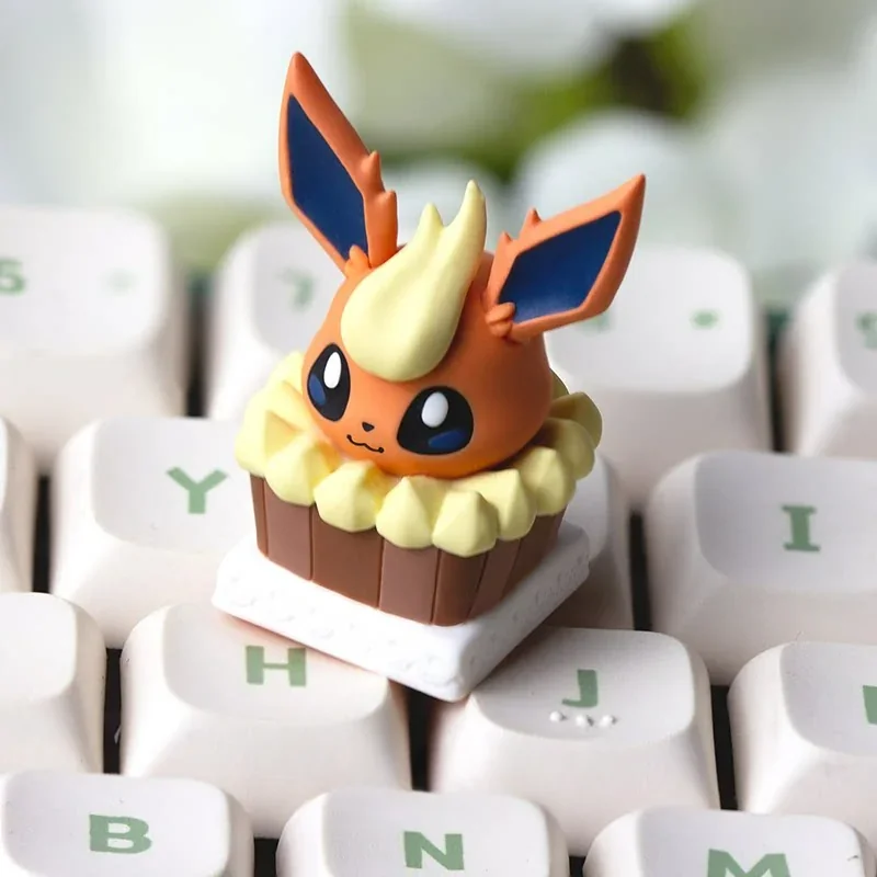 A vibrant, whimsical artisan Flareon cake keycap, showcasing a detailed Pokemon dessert theme for your ESC keyboard. Unique and playful.