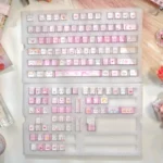 Folded Shadow Cat Keycaps set displayed from multiple angles, highlighting dye-sub PBT with playful feline silhouettes and ergonomic shapes.