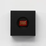 This premium zinc alloy Game Over keycap gallery image highlights its bold red and gold metallic finish and clear iconic lettering from various angle.