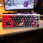 Gengar Crimson PBT Side-Lit Keycap Set, displaying the mischievous Gengar silhouette with crimson flames. Durable, playful Pokemon gaming keycaps.