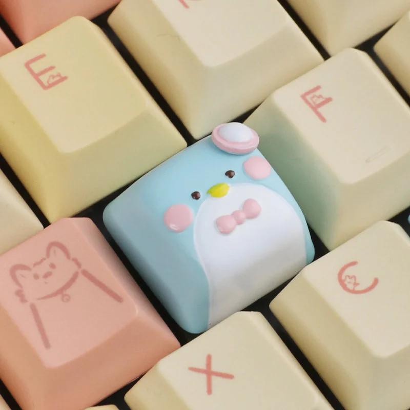 Artistic views of a handcrafted resin gentleman penguin keycap for ESC, revealing its unique details and elegant design.