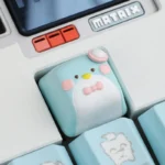 Handcrafted artisan resin Gentlemen Penguin keycap, multiple angles. Unique gentleman penguin design, elegant design, intricate hand-sculpted details.