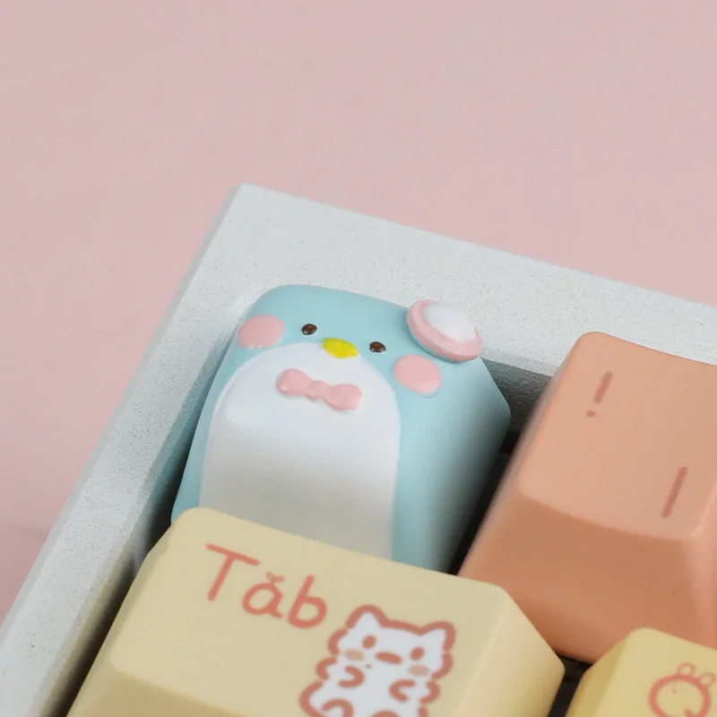 Handcrafted artisan resin Gentlemen Penguin keycap for ESC key, showing charming gentleman design and elegant design details from multiple angles.