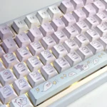 Whimsical Ghost Haha keycaps set in translucent PBT, showcasing their ethereal glow and playful design from various angles. Dreamy and enchanting design.