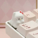 Whimsical Ghost Hello Kitty artisan ESC keycap crafted in resin, shown from various playful angles, highlighting its unique design.