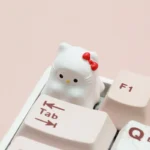 Close-up view of the whimsical Ghost Hello Kitty artisan ESC keycap, highlighting its unique resin details and playful ghostly charm, perfect for custom keyboard.