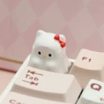 A unique Ghost Hello Kitty artisan keycap, an adorable ESC charm featuring a playful ghostly Hello Kitty crafted in resin, adding whimsical style.