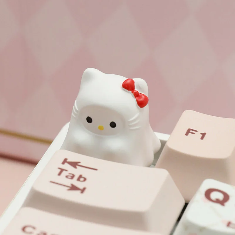 A unique Ghost Hello Kitty artisan keycap, an adorable ESC charm featuring a playful ghostly Hello Kitty crafted in resin, adding whimsical style.