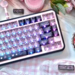 Vibrant transparent PC black pink graffiti keycap set, depicted from various angles, emphasizing its edgy art and translucent, modern street style.