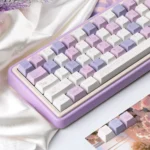 A luxurious Grape Mousse PBT Dye-Sub keycap set showcased from various angles, featuring soft hues, dessert-inspired hues for a premium keyboard.