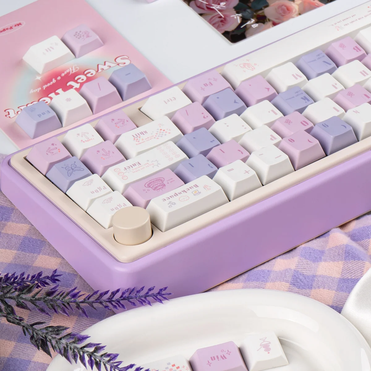 Grape Mousse PBT Dye-Sub Keycap Set, showcasing its soft hues from a unique angle, an indulgent and premium desk accessory.