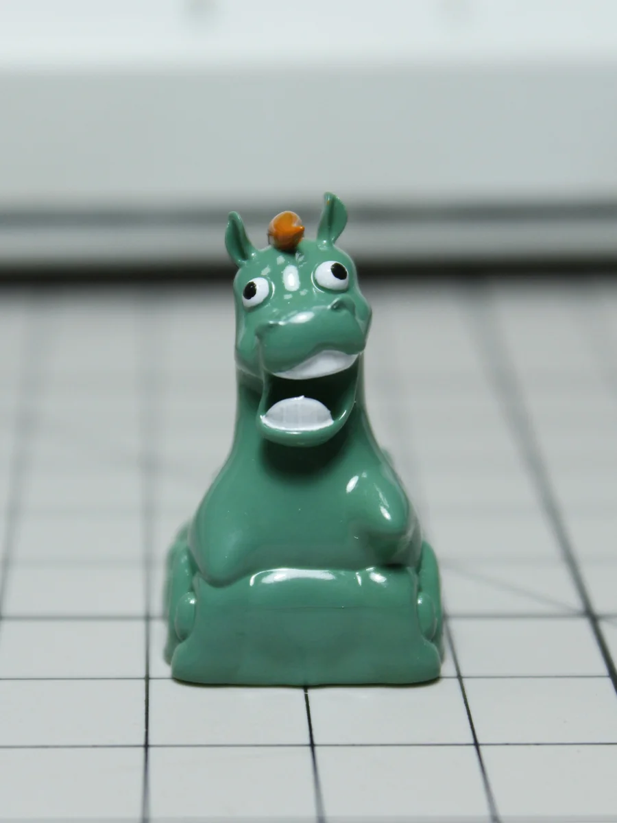 Handcrafted resin Green Pony Keycap, a whimsical green meadow artisan piece bringing enchanting pastoral charm to your desktop.