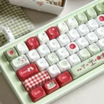 Apple PBT Keycaps Set. Vibrant green and red apple designs. Durable PBT keycaps, multiple angles, fresh and playful design.