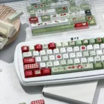 Experience the fresh, playful charm of green and red Apple PBT Keycaps Set, a durable 147-key Cherry profile set, boxed.