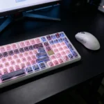 Exclusive Strike Freedom Gundam PBT dye-sublimated keycaps set, viewed from various angles, highlighting sleek, high-contrast iconic mecha designs.