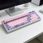Detailed view of the exclusive Strike Freedom Gundam PBT keycap set, showcasing sleek, high-contrast dye-sublimated mecha designs from a dynamic angle.