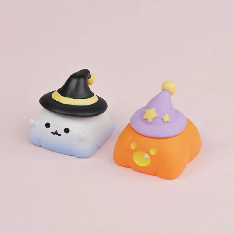 Charming handcrafted resin Halloween artisan keycaps, depicting detailed ghost and pumpkin figures from various angles, highlighting artistic craftsmanship.