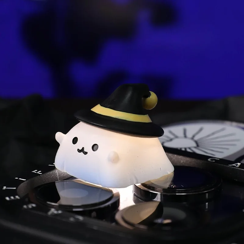 Charming handcrafted resin Halloween artisan keycap featuring a whimsical ghost and pumpkin, viewed from various angles, highlighting its sculpted design.