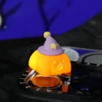 Multiple angles of a charming handcrafted resin Halloween artisan keycap featuring whimsical sculpted ghost and pumpkin figures, showcasing artistic design.