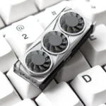 Close-up of a unique handcrafted resin graphics card keycap, showcasing its intricate miniature details and vibrant artistic design for PC gaming.