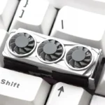 Detailed side view of a vibrant handcrafted resin graphics card keycap, featuring its unique miniature tech-inspired design, ideal for custom PC gaming setup.