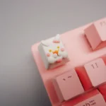 Close-up detail of a whimsical handcrafted rabbit keycap, showcasing its exquisite sculpted details, adorable pastel hues, and artisan miniature art.