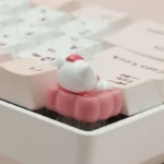 Close-up of a whimsical Hello Kitty dessert artisan ESC keycap, showcasing its adorable sweet treats and intricate details for a delightful desktop setup.